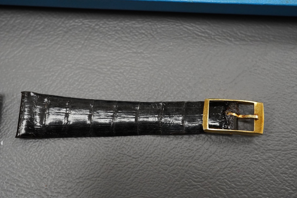 A gentleman's 18ct Girard-Perregaux manual wristwatch, oval brushed gilt dial with raised hour baton marks, seventeen jewels movement, signed, on an associated gilt metal articulated bracelet, in original case.